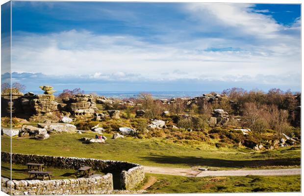 Scenic landscape with rocky formations, greenery, and a clear sky, ideal for travel and nature themes at Brimham Rocks, in North Yorkshire Canvas Print by Man And Life