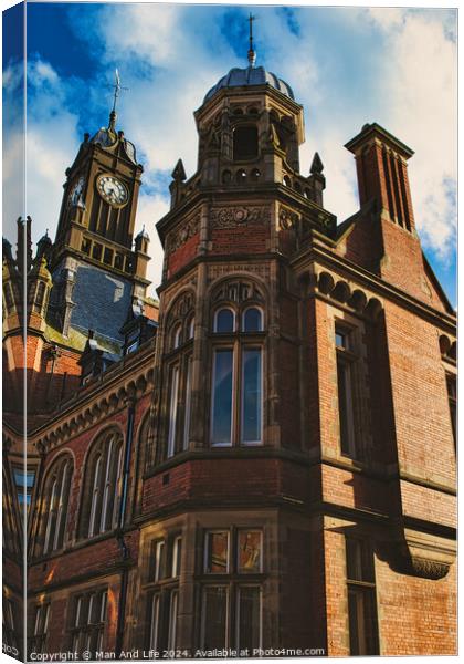 Victorian architecture with a clock tower under a blue sky, showcasing intricate brickwork, historical design, and a sense of timeless elegance in York, North Yorkshire, England. Canvas Print by Man And Life
