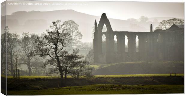 Bolton Abbey in the Mist Canvas Print by John Parker