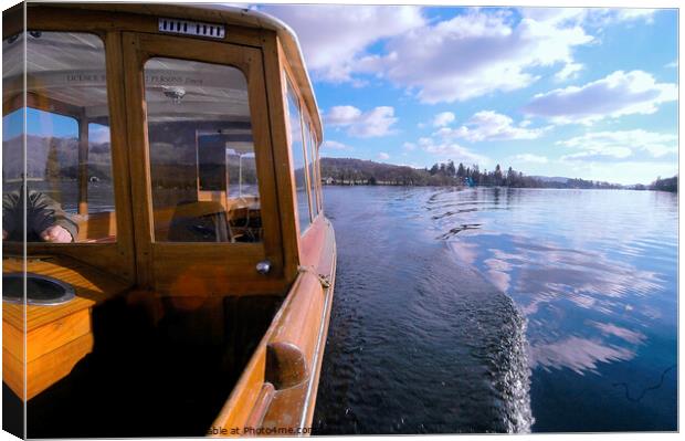 Wooden boat cruising on Windermere, Lake Distict. Canvas Print by Phil Brown