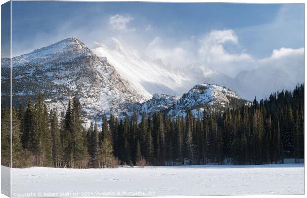 Dramatic Winter weather storm on 14,259 Foot Longs Peak viewed from frozen snow covered Bear Lake. Canvas Print by Robert Waltman