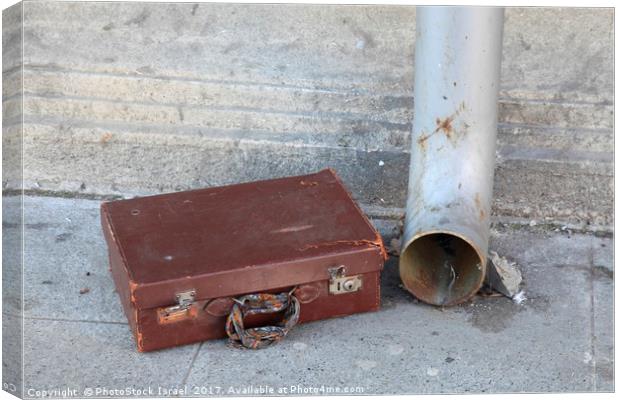 Old cardboard suitcase in the street Canvas Print by PhotoStock Israel