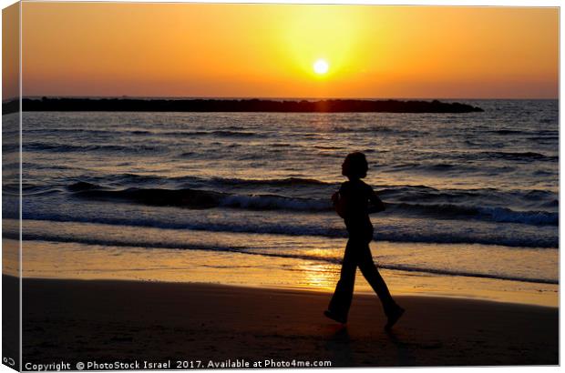 Israel, Tel Aviv, running on the beach Canvas Print by PhotoStock Israel
