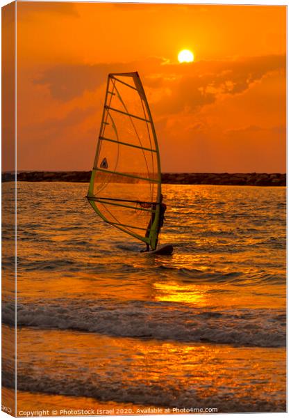 windsurfing at sunset Canvas Print by PhotoStock Israel