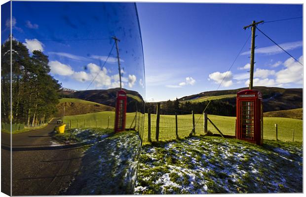 Red phonebooth and Scottish landsape reflecting in Canvas Print by Gabor Pozsgai