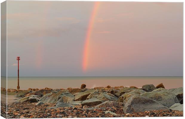Rainbow out at Sea Canvas Print by Sarah Couzens