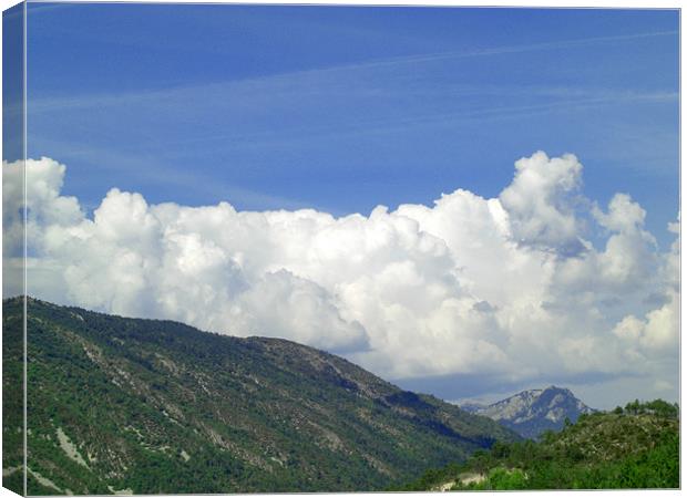 Mountain with Fluffy Clouds Canvas Print by George Thurgood Howland