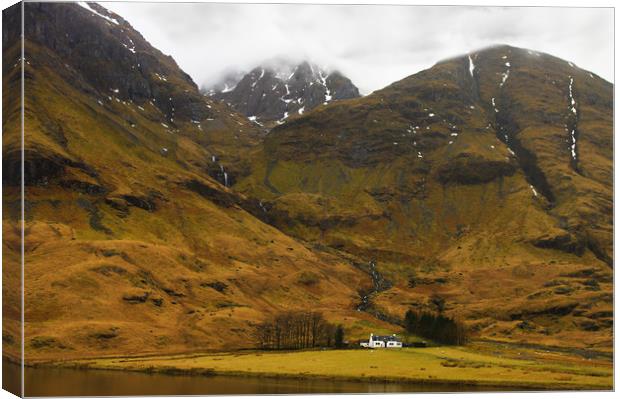 Glencoe Cottage in the Mountains Canvas Print by Jacqi Elmslie