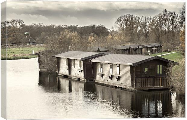 Wooden Boathouses Canvas Print by Stephen Mole