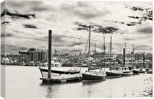 Boats moored in Wells Harbour Canvas Print by Stephen Mole