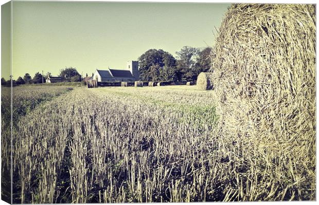 Hay Bales over Ormesby St. Michael church Canvas Print by Stephen Mole