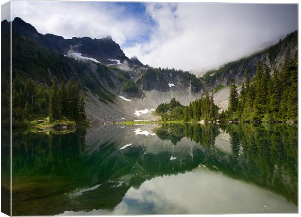 Snow LAke Reflected Canvas Print by Mike Dawson