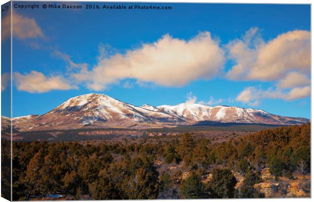 Snow on the Peaks Canvas Print by Mike Dawson