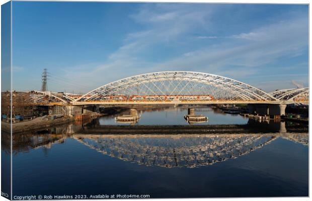 Krakow railway bridge reflections Canvas Print by Rob Hawkins