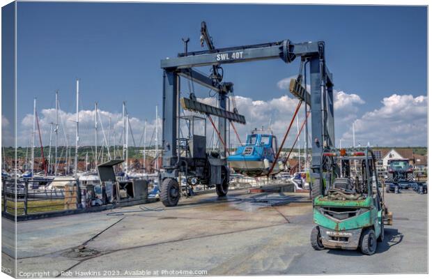 Marina boat lift  Canvas Print by Rob Hawkins