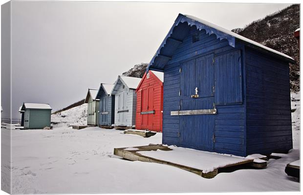 Snow Covered Beach Huts in Overstrand Canvas Print by Paul Macro