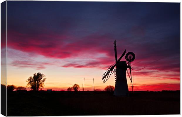 Fire in the sky at Thurne Canvas Print by Paul Macro