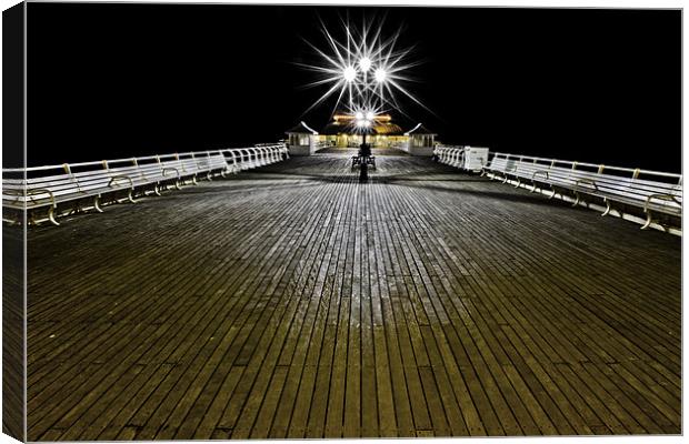 'Pier'ing into the distance Canvas Print by Paul Macro