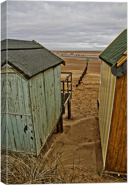 View through the huts at Wells Canvas Print by Paul Macro