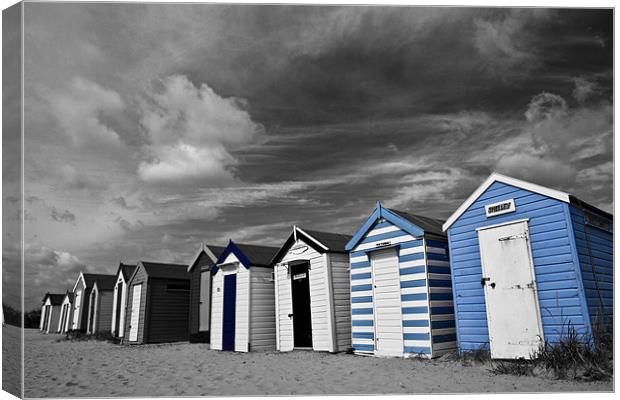 Blue Beach Huts in Southwold Canvas Print by Paul Macro