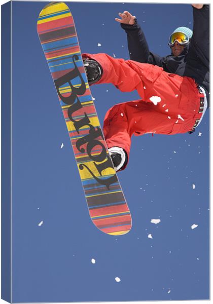 Snowboard jumping on Vogel mountain Canvas Print by Ian Middleton
