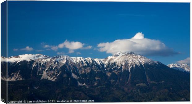 Karavank Alps in Slovenia.  Canvas Print by Ian Middleton