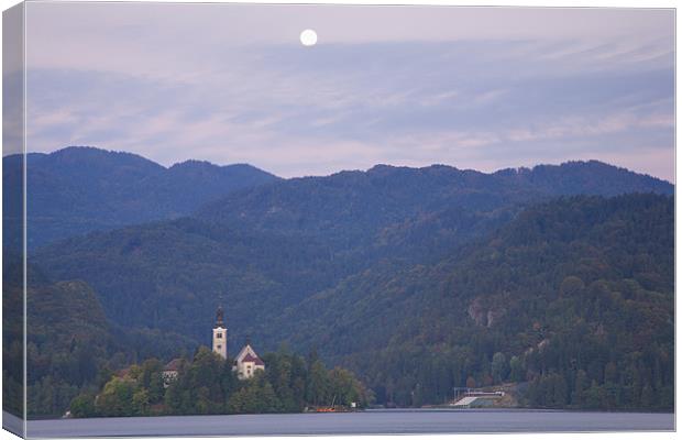 Moon setting at sunrise Lake Bled Canvas Print by Ian Middleton