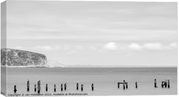 Swanage Old Pier with Old Harry in the distance Canvas Print by Ian Middleton