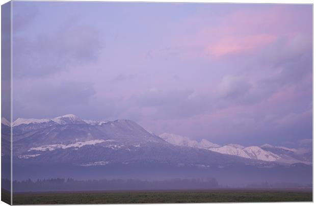 Krvavec and the Kamnik Alps at sunset Canvas Print by Ian Middleton