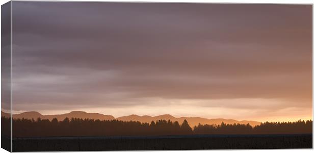 Dawn breaks over Gorenjska Canvas Print by Ian Middleton