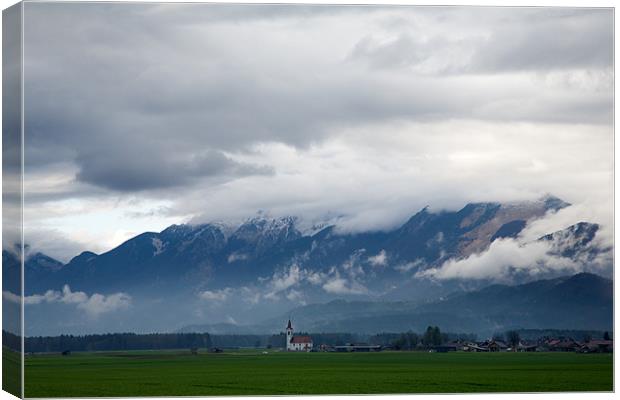 The Kamnik Alps after a storm Canvas Print by Ian Middleton