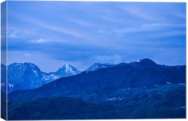 Krvavec and the Kamnik Alps at dusk Canvas Print by Ian Middleton