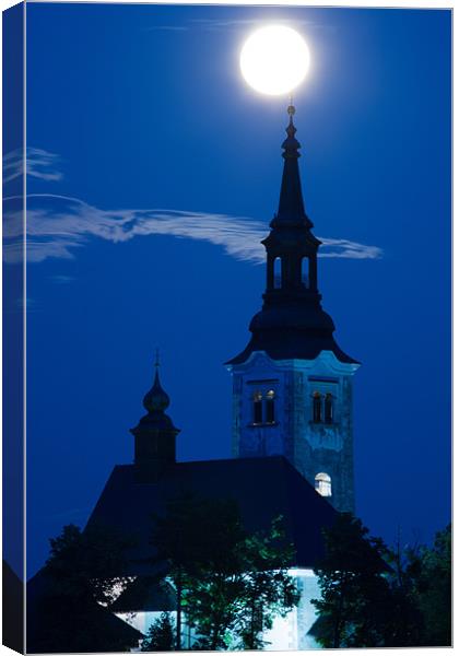 Supermoon over bled Island Church Canvas Print by Ian Middleton