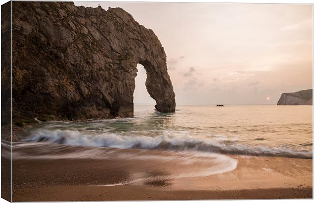 Sunset at Durdle Door Canvas Print by Ian Middleton