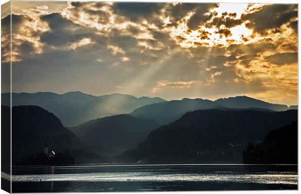 Angel rays over Lake Bled Canvas Print by Ian Middleton