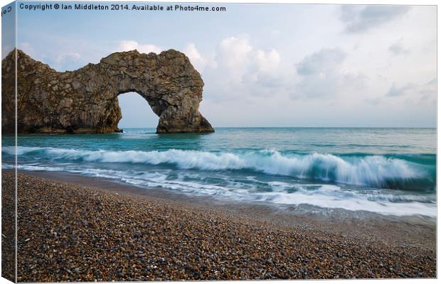 Durdle Door in the evening Canvas Print by Ian Middleton