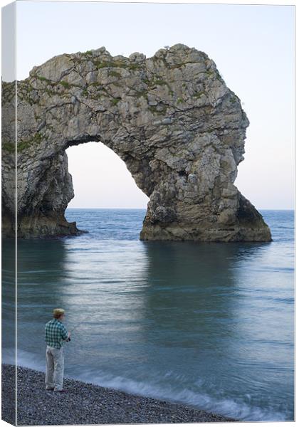 Man fishing at Durdle Door near Lulworth cove. Canvas Print by Ian Middleton