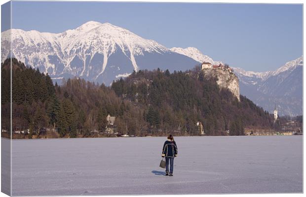 Lake Bled frozen in winter, Slovenia. Canvas Print by Ian Middleton