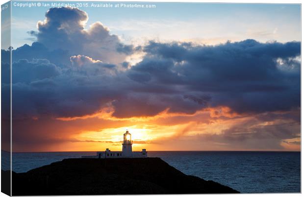 Sunset at Strumble Head Lighthouse Canvas Print by Ian Middleton