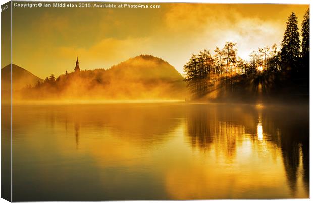 Misty sunrise at Lake Bled Canvas Print by Ian Middleton