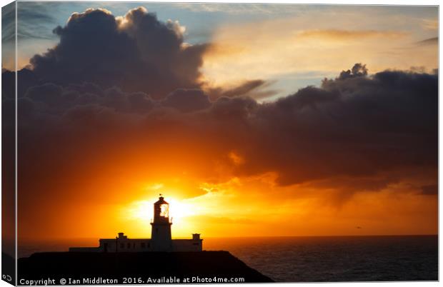 Sunset at Strumble Head Lighthouse Canvas Print by Ian Middleton