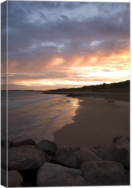 Highcliffe Beach at sunset Canvas Print by Ian Middleton