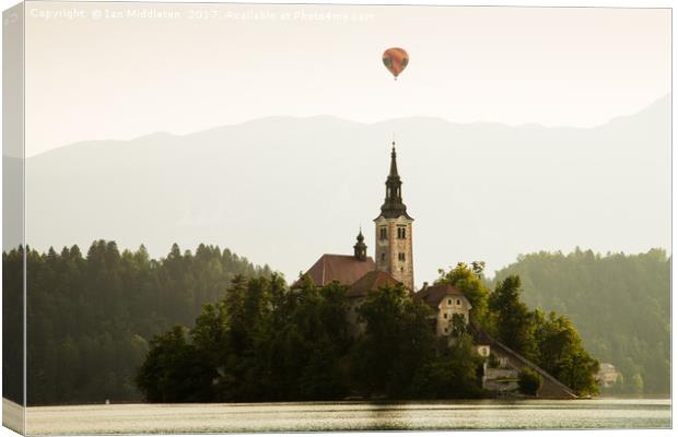 Hot air Balloon over Lake Bled and the Island chur Canvas Print by Ian Middleton
