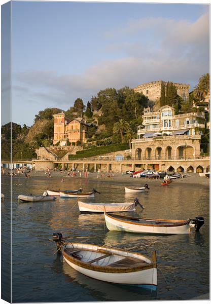 Boats moored at Levanto Beach. Canvas Print by Ian Middleton