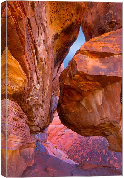 Rocks at sunset. Canvas Print by David Hare