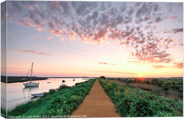 Boats and footpath at sunrise. Burnham Overy Staithe, Norfolk, U Canvas Print by Liam Grant