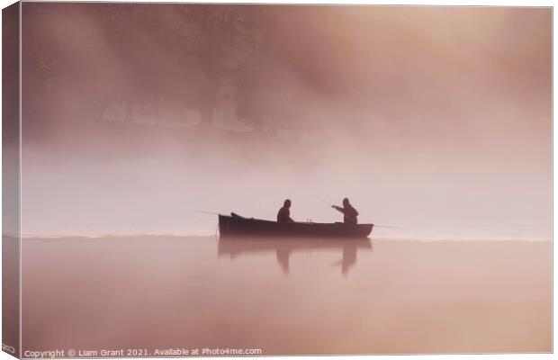 People fishing from a boat on a misty lake at dawn. Canvas Print by Liam Grant
