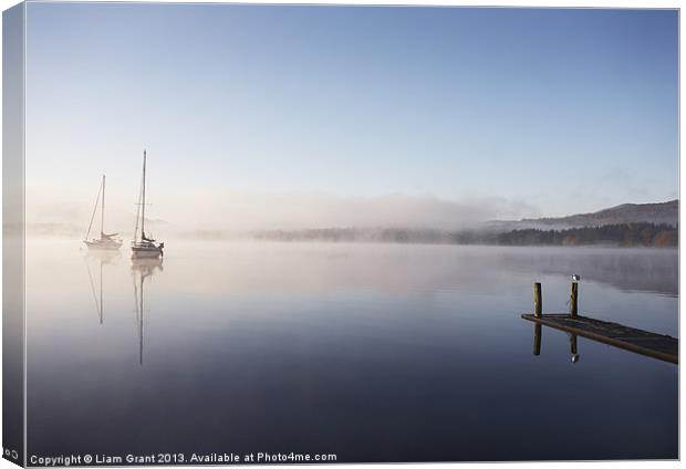 Morning mist and boats on Lake Windermere. Canvas Print by Liam Grant