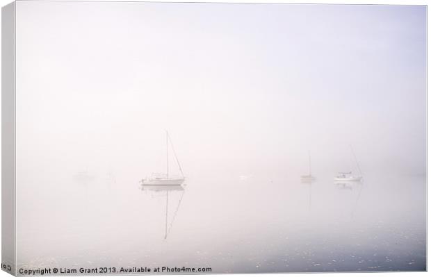 Boats in fog on Lake Windermere. Waterhead, Lake D Canvas Print by Liam Grant