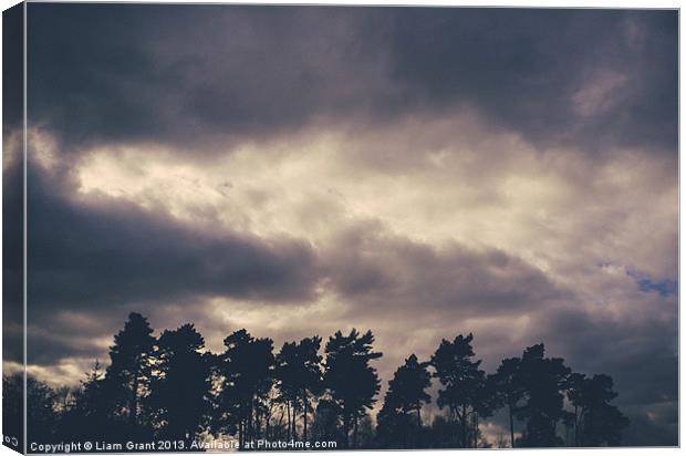 Rainclouds at sunset. Lynford, Norfolk, UK. Canvas Print by Liam Grant